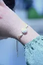 Les-moires-du-temps-bracelet-coquillage-doré-mésé.webp