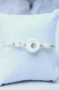 Les-moires-du-temps-bracelet-coquillage-doré-non-porté-dos-mésé.webp