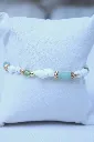 Les-moires-du-temps-bracelet-aventurine-verte-coquillage-peridot-non-porté-doré-mésé.webp