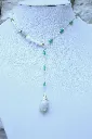 Les-moires-du-temps-collier-aventurine-verte-coquillage-peridot-non-porte-olibianus.webp
